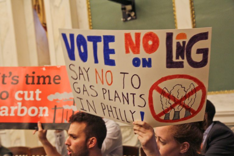 Opposition to the proposed liquefied natural gas plant in Philadelphia protest in city council chambers in 2019. (Kimberly Paynter/WHYY)